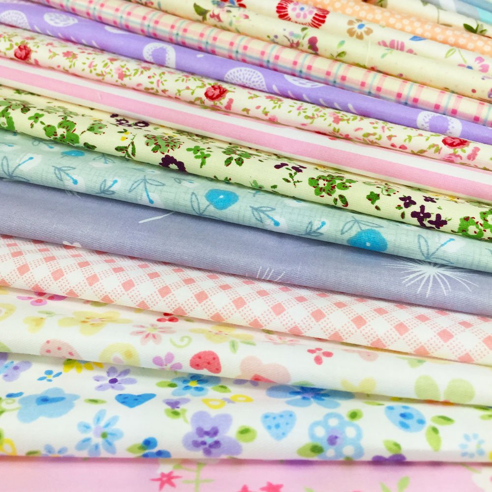 Stack of assorted floral, polka dot, stripe, and gingham fabric squares for sewing and crafts.