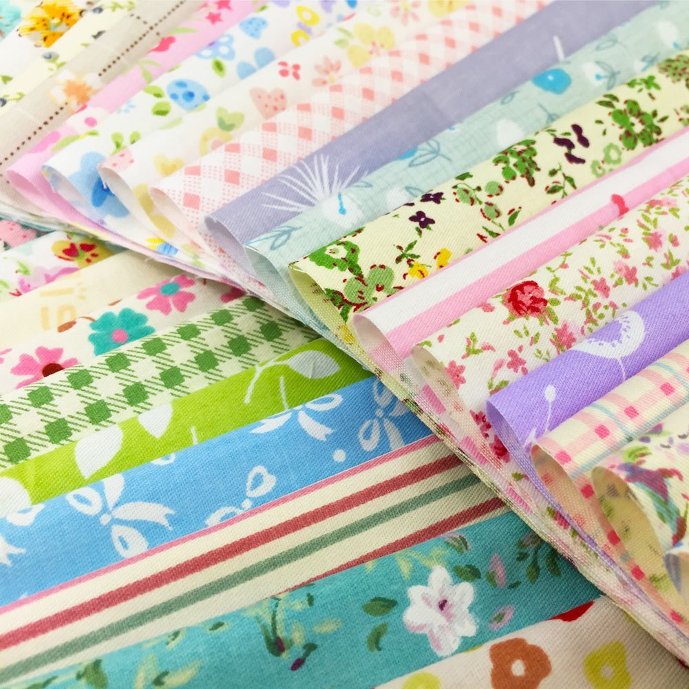 Assorted floral, polka dot, stripe, and gingham fabric squares fanned out, showing various colors and patterns.