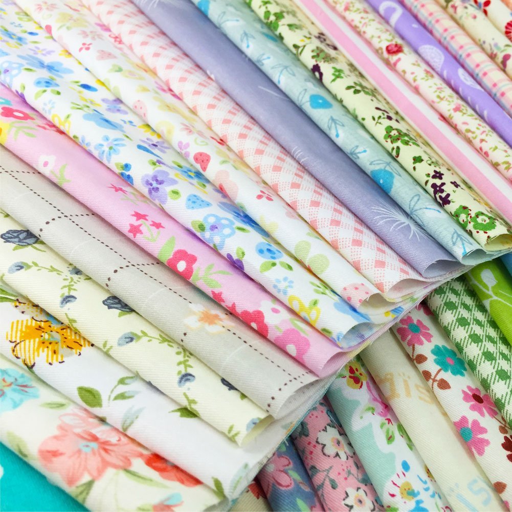Stack of 120 precut quilting fabric squares in floral and printed patterns, 6x6 inch size, pastel colors.