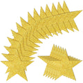 Glitter gold paper star cutouts arranged in two groups on a white background.