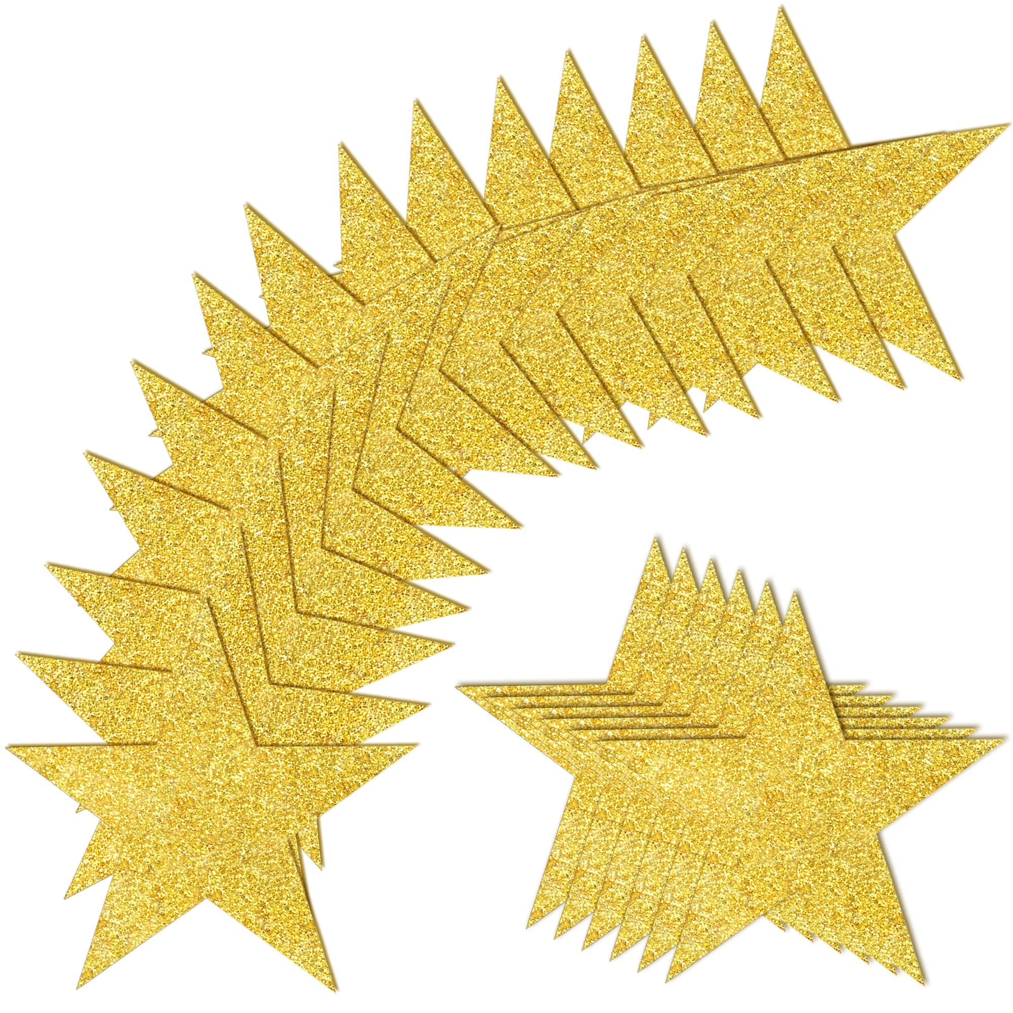 Glitter gold paper star cutouts arranged in two groups on a white background.