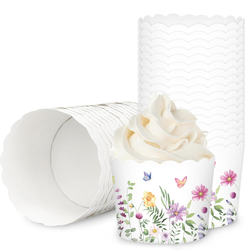 Wildflower paper baking cups with scalloped edges, one filled with frosting, others stacked.