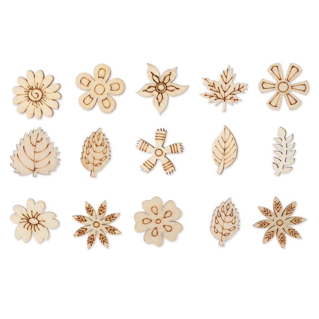 Assortment of 15 unfinished wooden flower and leaf craft cutouts on a white background.
