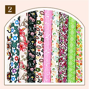 Ten rolled fabric squares with floral and geometric patterns, numbered 2 in the top left corner.