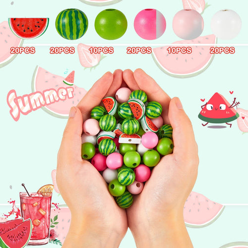 Hands holding a pile of colorful wooden beads, including watermelon-themed and solid green, pink, and white beads.
