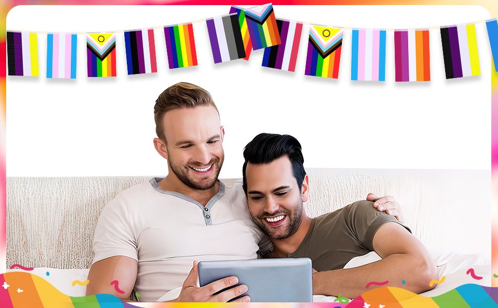 Two men smiling while looking at a tablet, with rainbow pride flag bunting overhead and colorful confetti at the bottom.