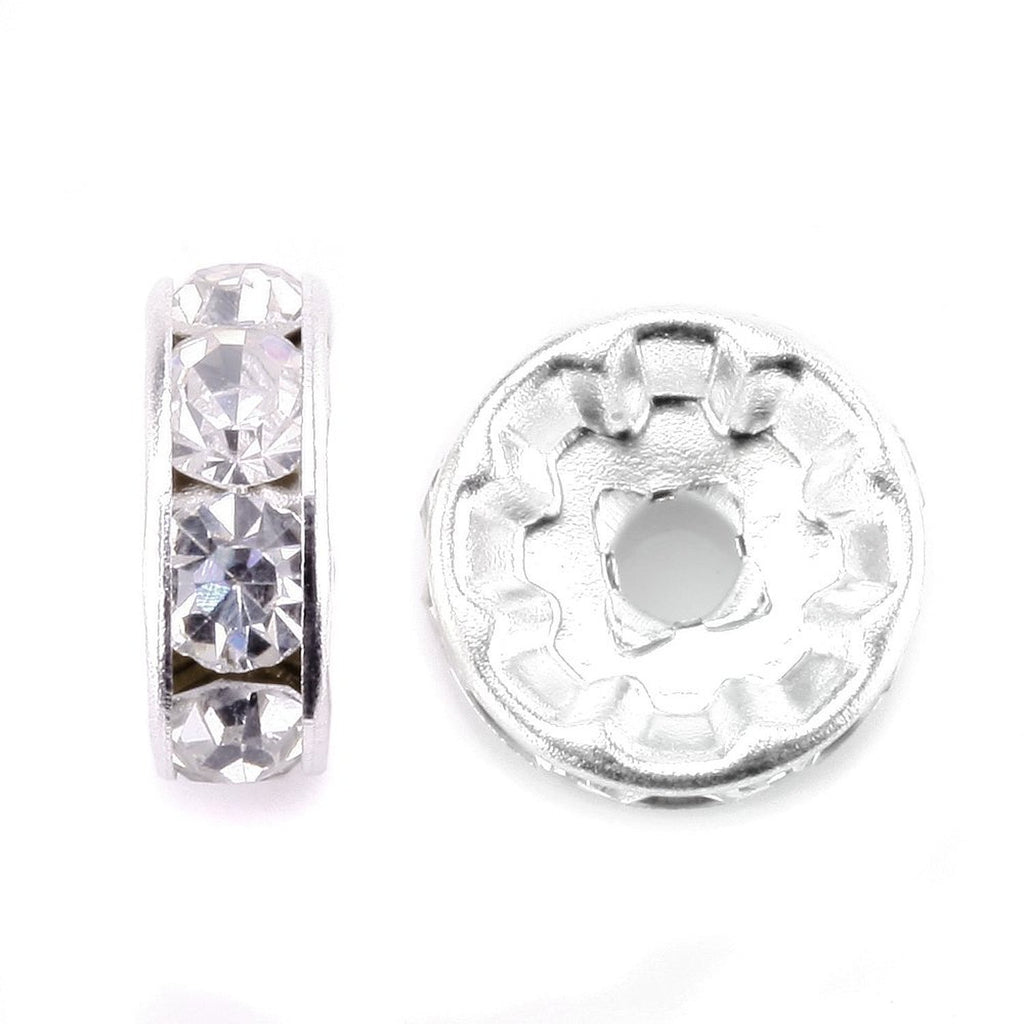 Two silver-plated rondelle spacer beads with clear rhinestones on a white background.