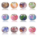 Set of twelve colorful glass beads with brass cores, displayed in three rows on a white background.
