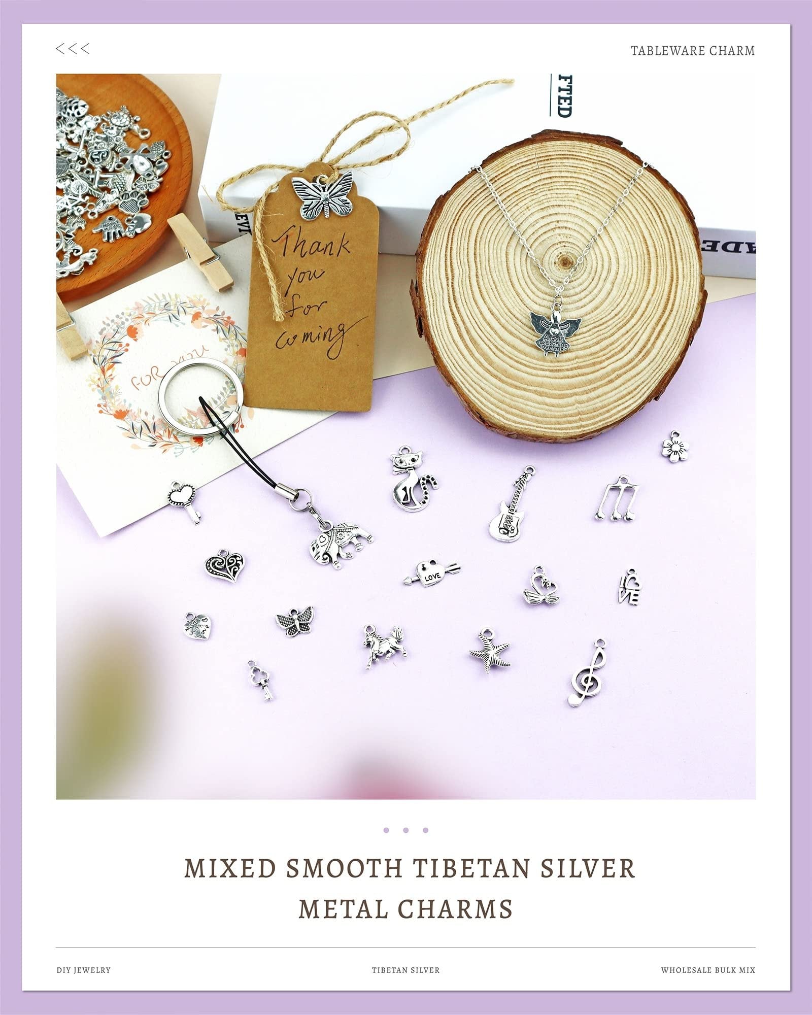 Assortment of mixed Tibetan silver alloy charms for jewelry making, including animals, musical notes, and hearts, displayed on a light purple surface.