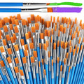 Close-up of a large collection of paint brushes with blue handles and orange bristles, two brushes at the top show green and purple paint strokes.