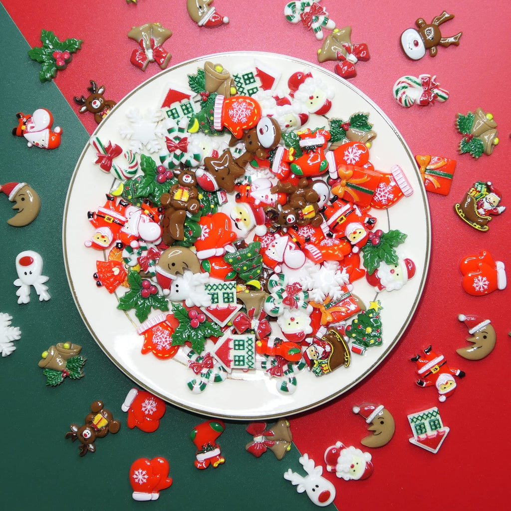 Assorted 3D Christmas resin charms including Santas, reindeer, gingerbread men, and candy canes on a white plate.
