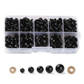 Assorted black plastic safety eyes and washers in a divided clear plastic case, with individual eyes and washers displayed below.
