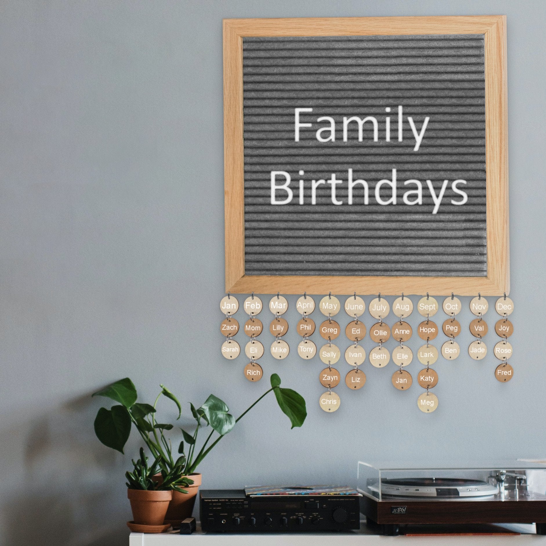 Felt letter board displaying 'Family Birthdays' with hanging wooden discs for names and months.