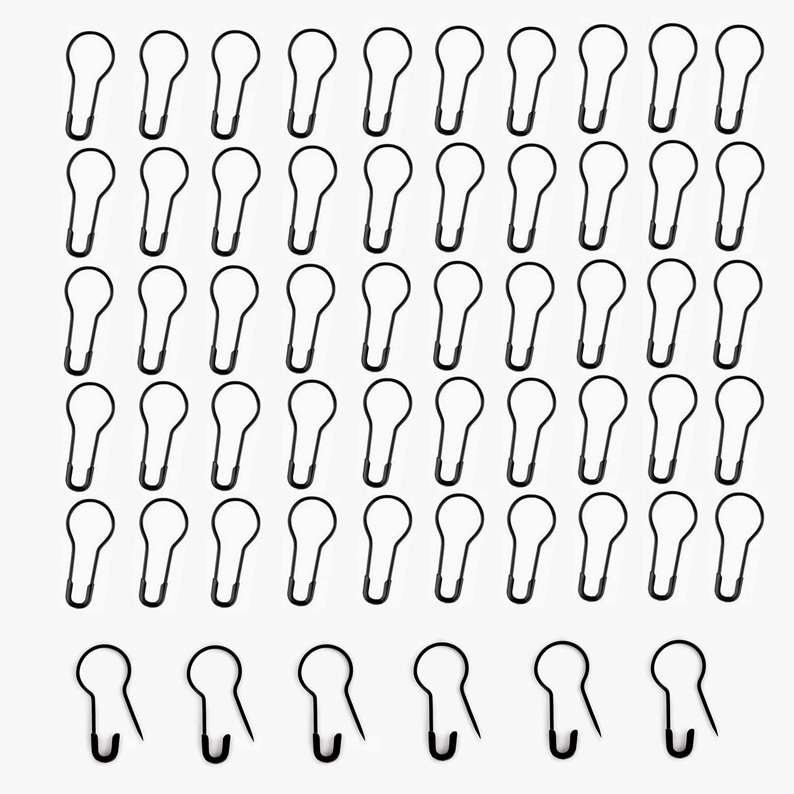 Black metal gourd-shaped safety pins arranged in rows on a white background, with a few shown open.