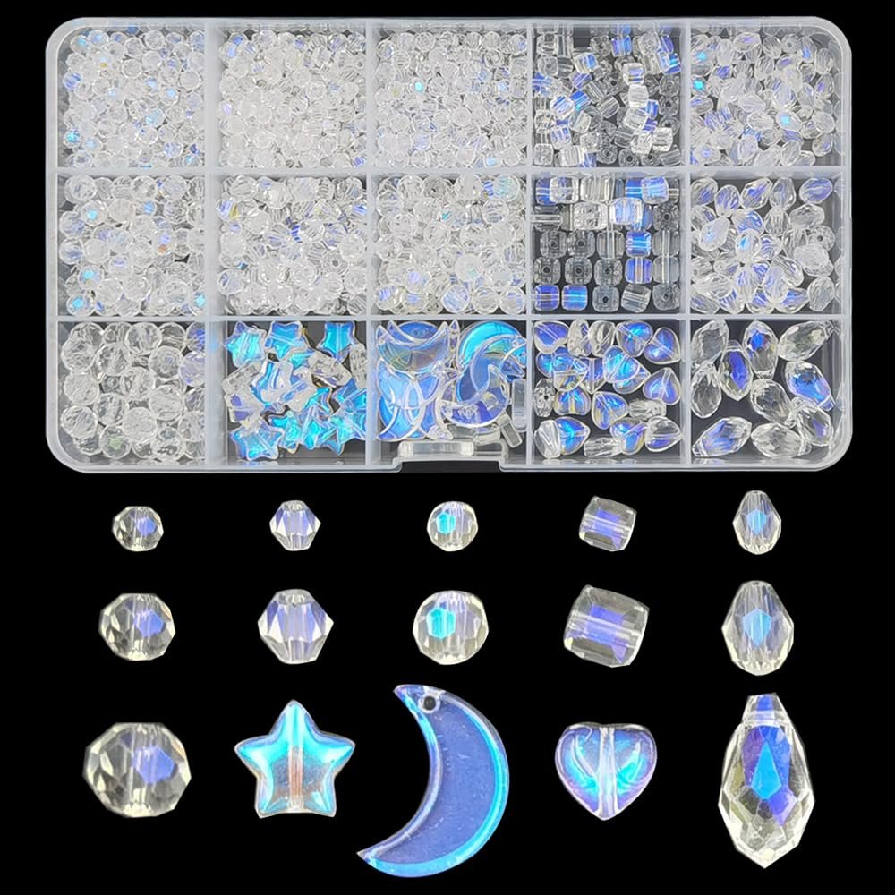 Assorted crystal glass beads in various shapes and sizes, including stars and moons, displayed in a clear organizer box and arranged below.