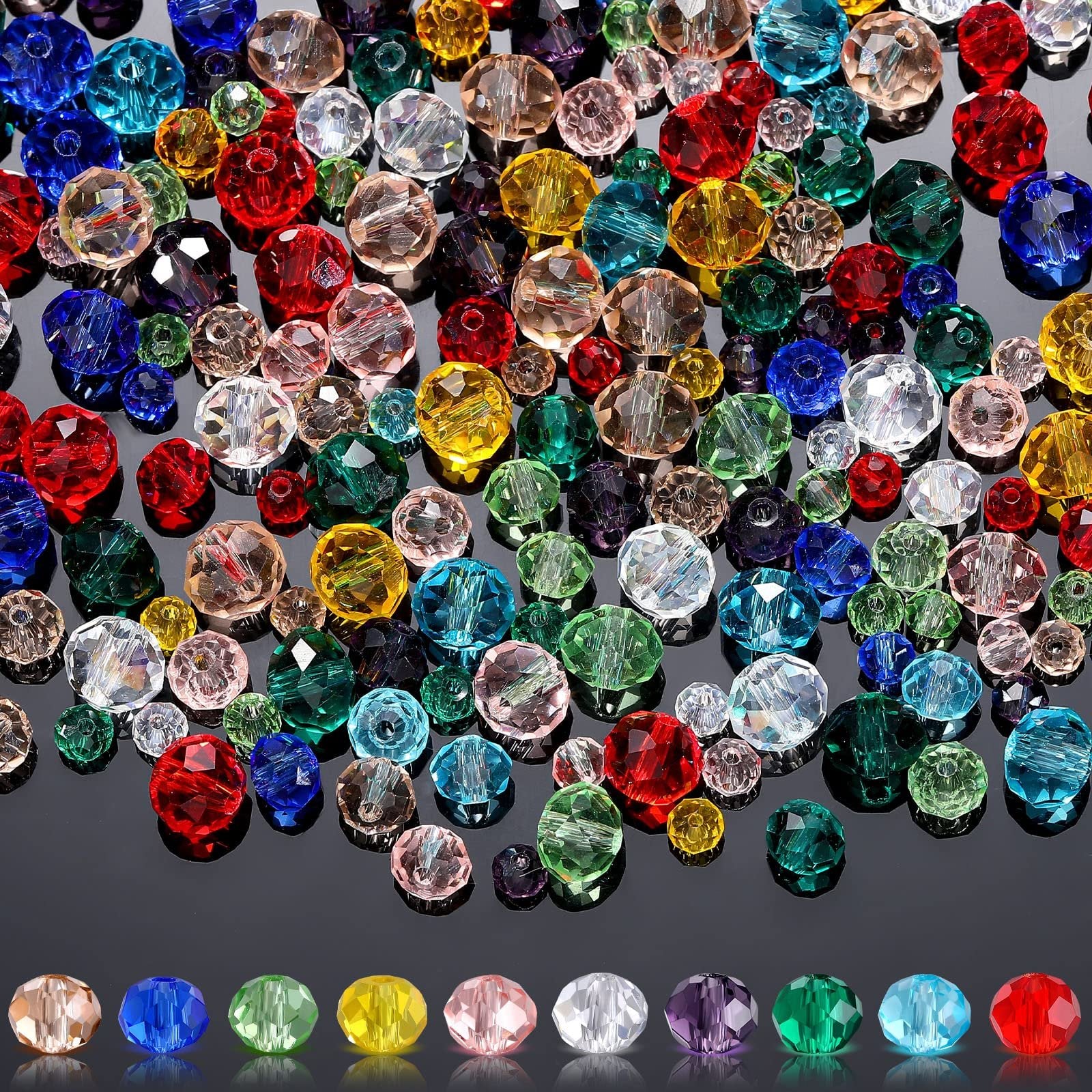 Assortment of faceted rondelle crystal beads in various colors and sizes scattered on a reflective surface, with a row of individual beads shown below.