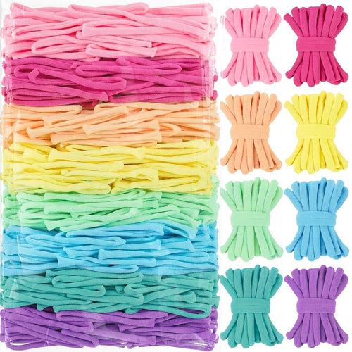 A large package of colorful nylon loom loops in pink, peach, yellow, green, blue, and purple, with smaller bundles of loops arranged to the right.
