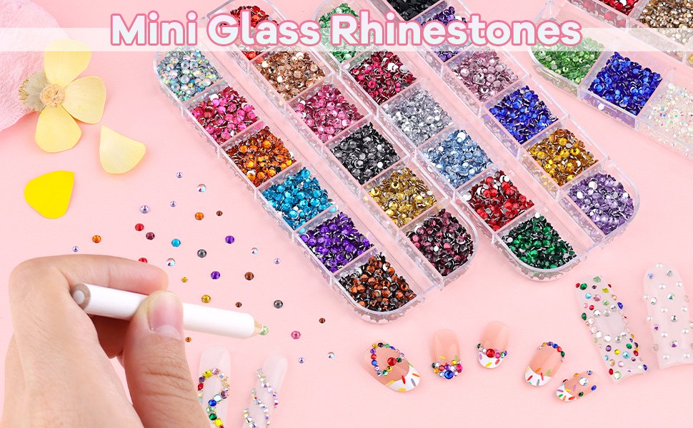 Nail art rhinestones in a divided case with a pick-up pencil and decorated nails