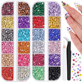 Assorted multicolor flatback resin rhinestones in divided containers with tweezers and pick-up pencil, plus decorated fingernails.