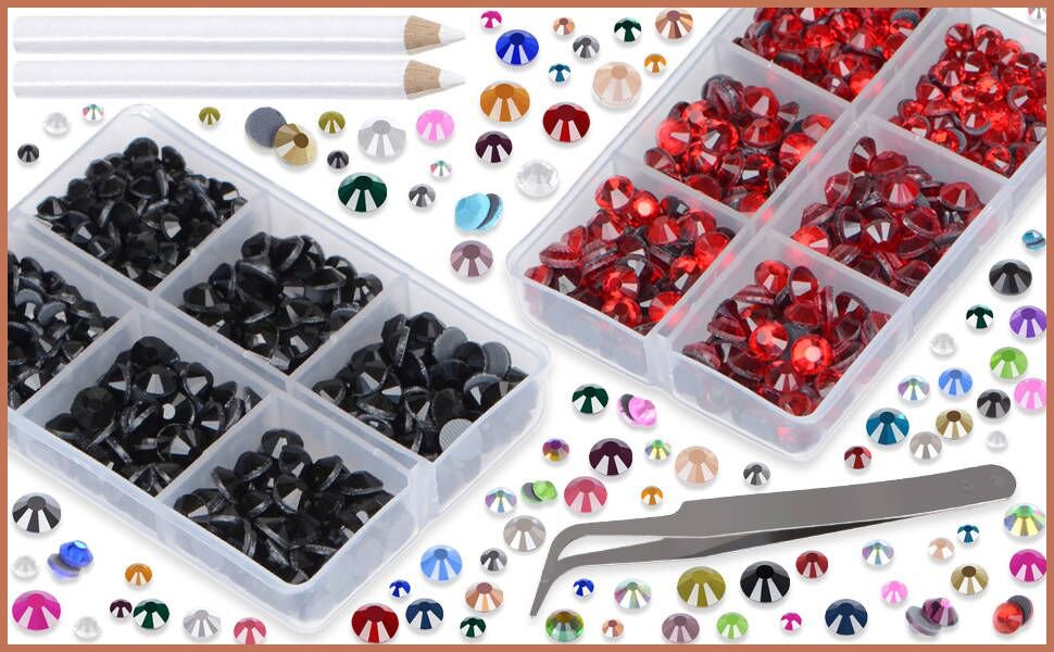 Flatback glass rhinestones in mixed colors and black, with tweezers and picking pen, organized in plastic compartments.