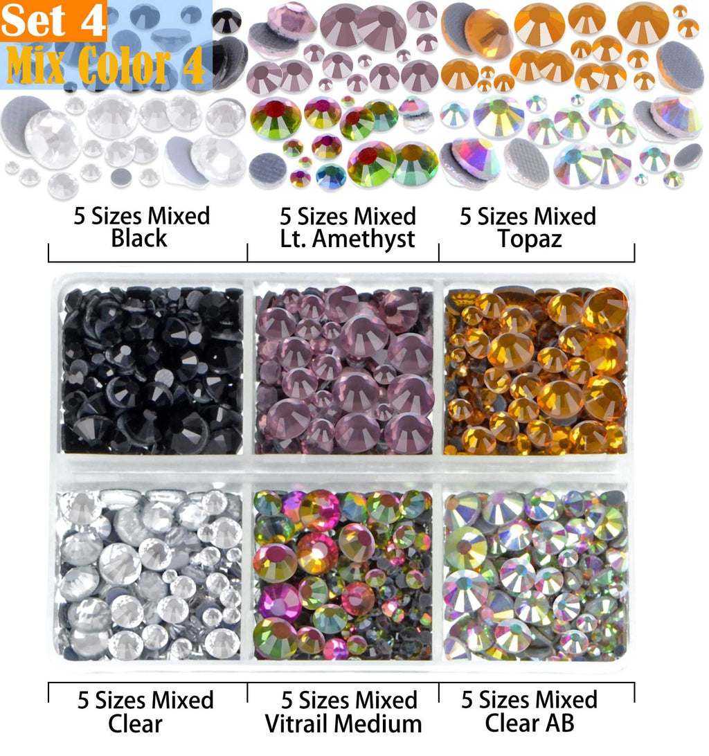Assortment of mixed color hotfix rhinestones in various sizes and colors, displayed in compartments and loose.