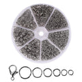 Silver open jump rings and lobster clasps in a clear divided organizer case and laid out below