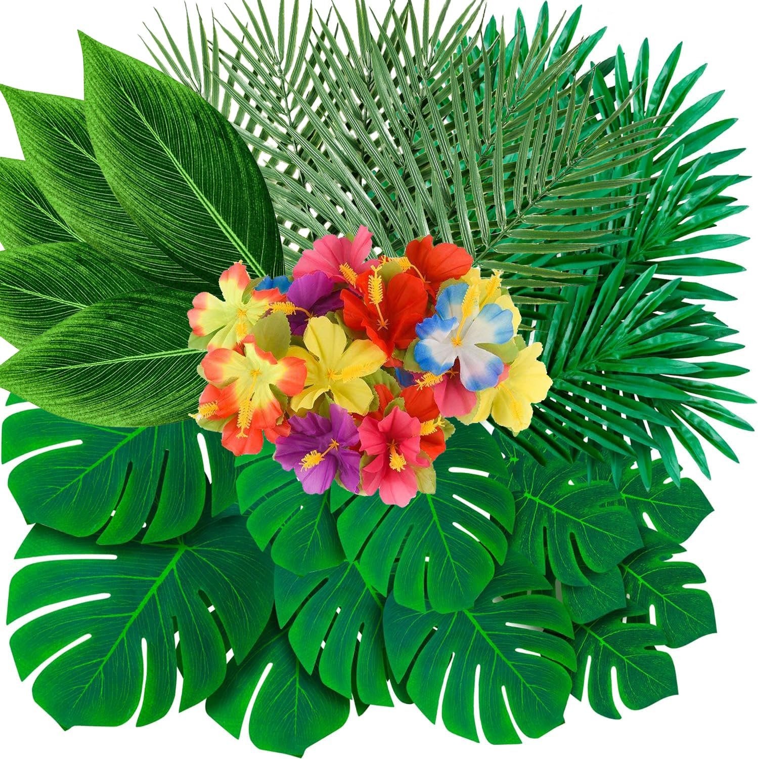 Assortment of artificial tropical leaves and hibiscus flowers in various colors on a white background.