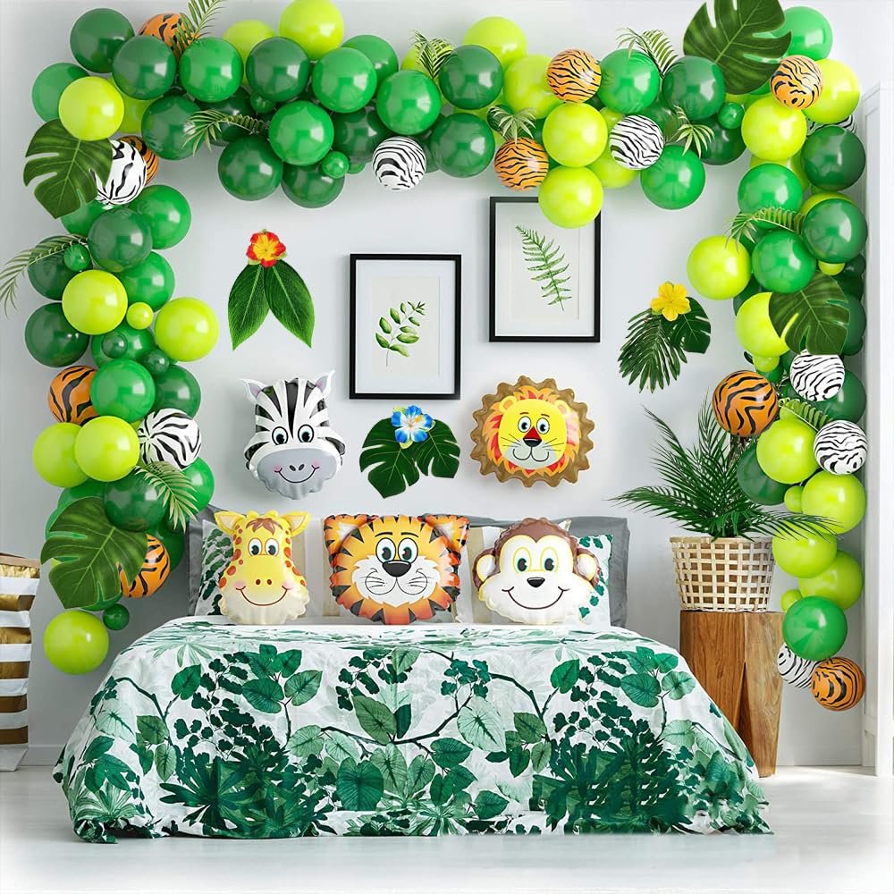 Tropical jungle-themed bedroom decor with balloon arch, animal foil balloons, and floral bedding.