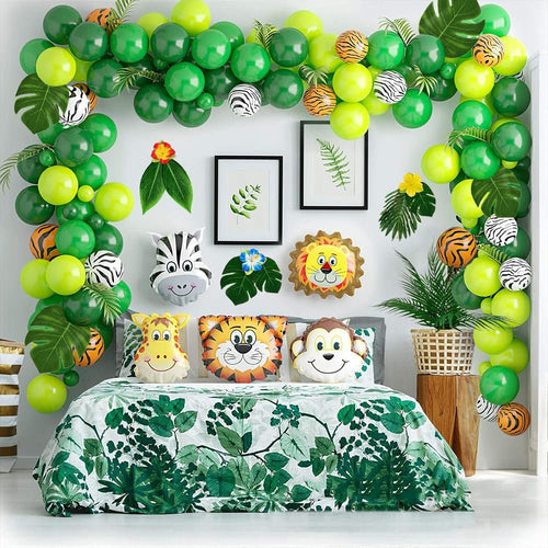 Tropical jungle-themed bedroom decor with balloon arch, animal foil balloons, and floral bedding.