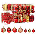 Set of red and gold Christmas ball ornaments in clear plastic display boxes and arranged on a white background.