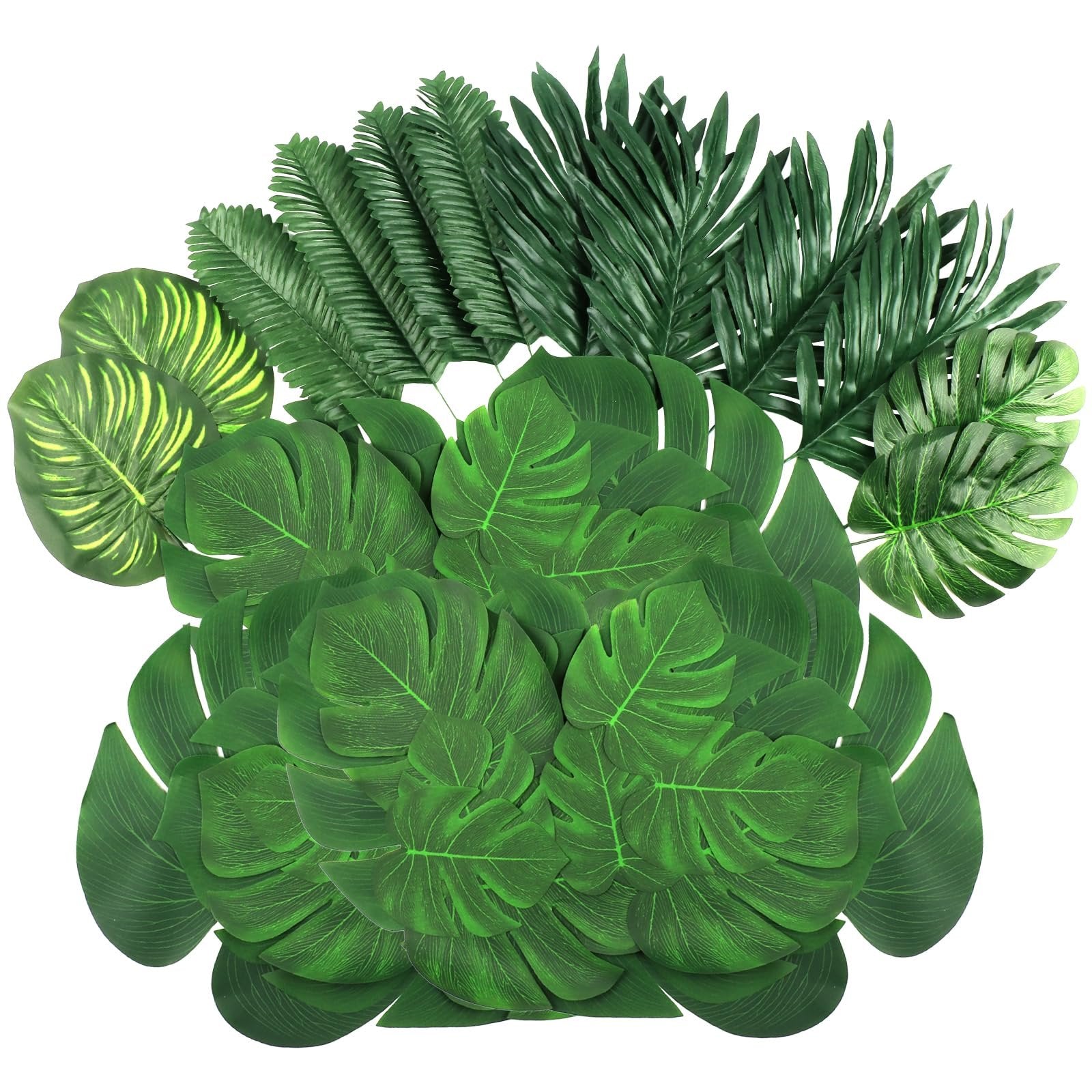 Assortment of artificial tropical leaves including monstera and palm varieties, arranged on a white background.