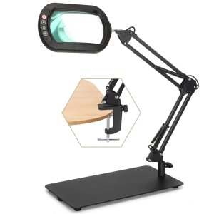 Adjustable magnifying glass lamp with clamp and base, showing close-up of clamp attachment to wood surface.