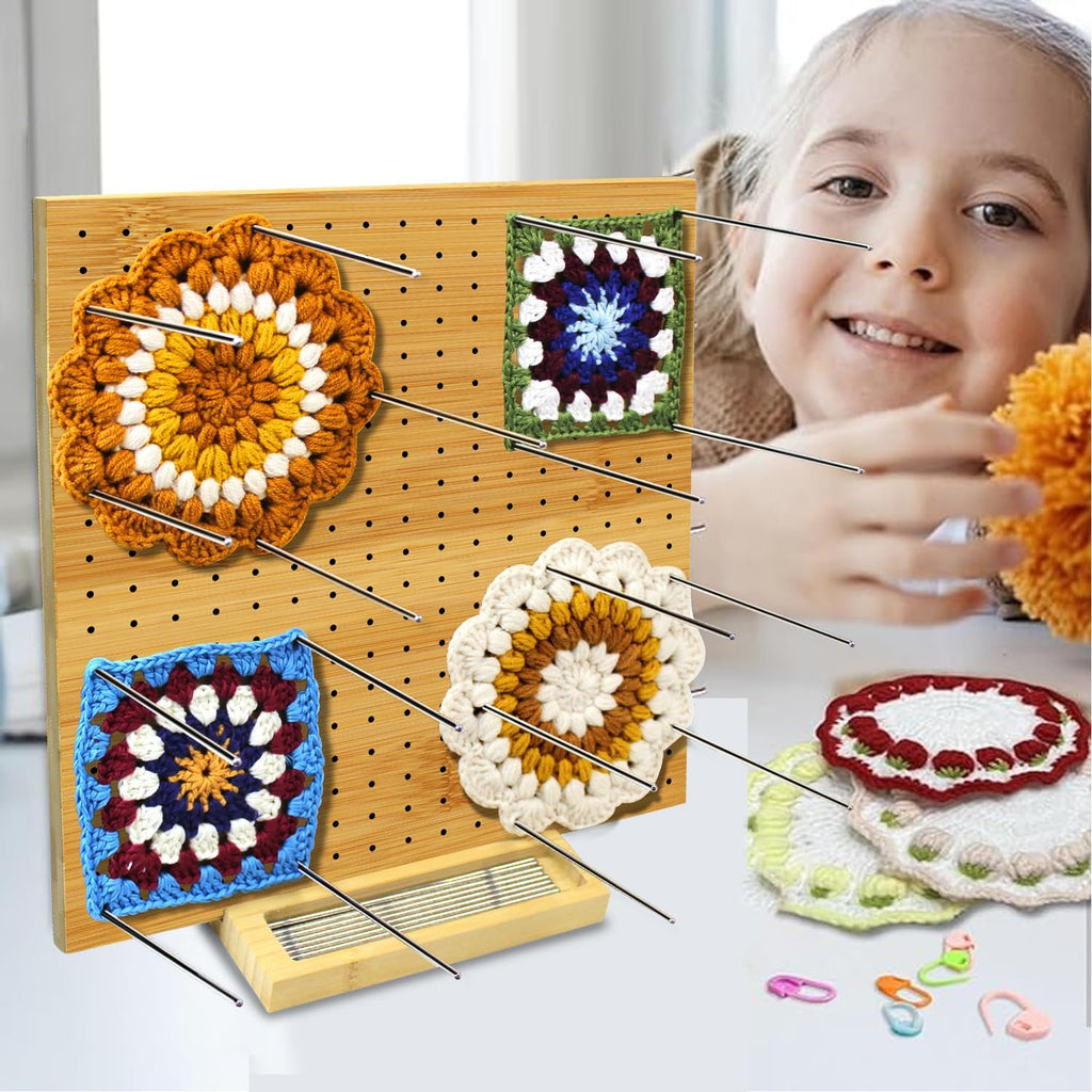 Bamboo blocking board with crochet squares and pins, with a smiling child in the background.