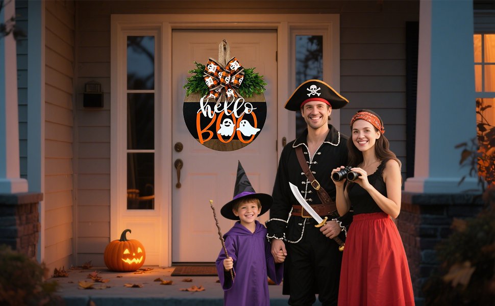 Family in Halloween costumes posing on a porch with a 'hello BOO' hanging sign and a jack-o'-lantern