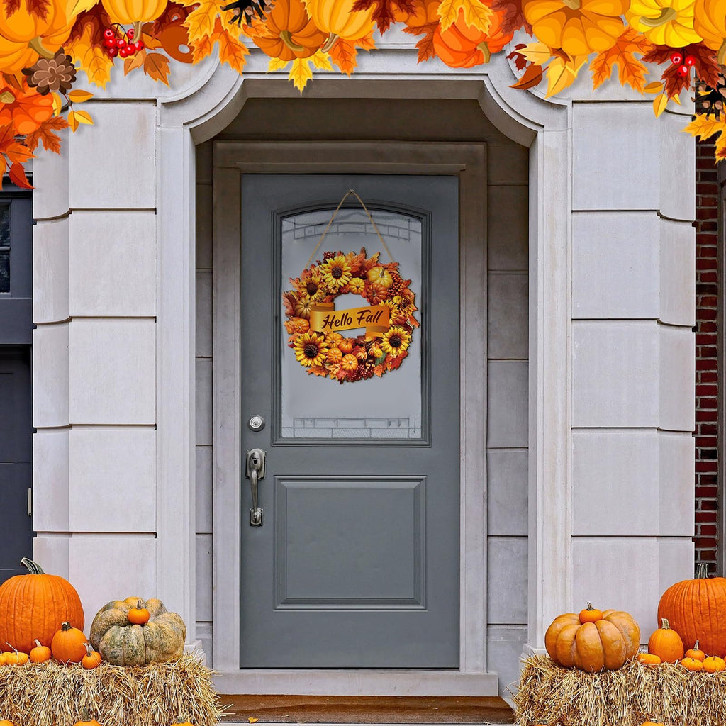 Fall wreath with sunflowers, pumpkins, and maple leaves hanging on a gray front door, decorated with pumpkins and hay bales.
