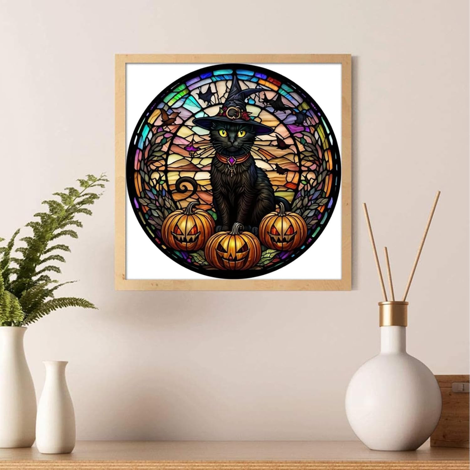 Diamond painting kit of a black cat in a witch hat with pumpkins, designed to look like stained glass.