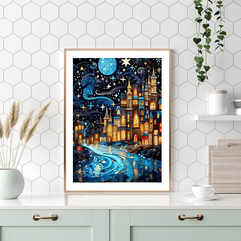 Framed 5D diamond painting of a whimsical castle town at night with a glowing river.