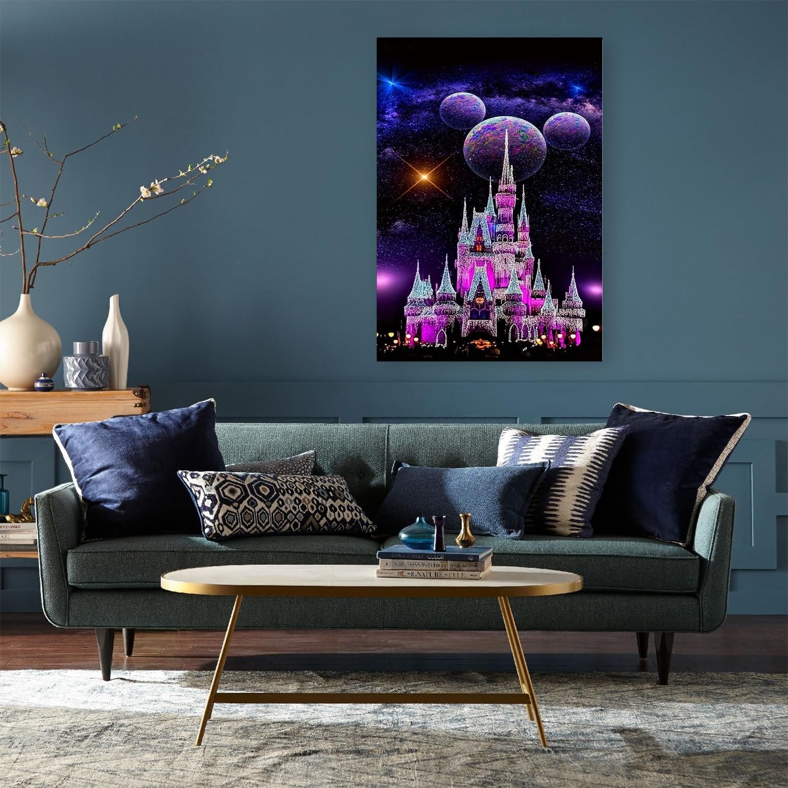 Diamond art painting of a pink castle with planets and stars in a night sky, displayed on a wall above a sofa.