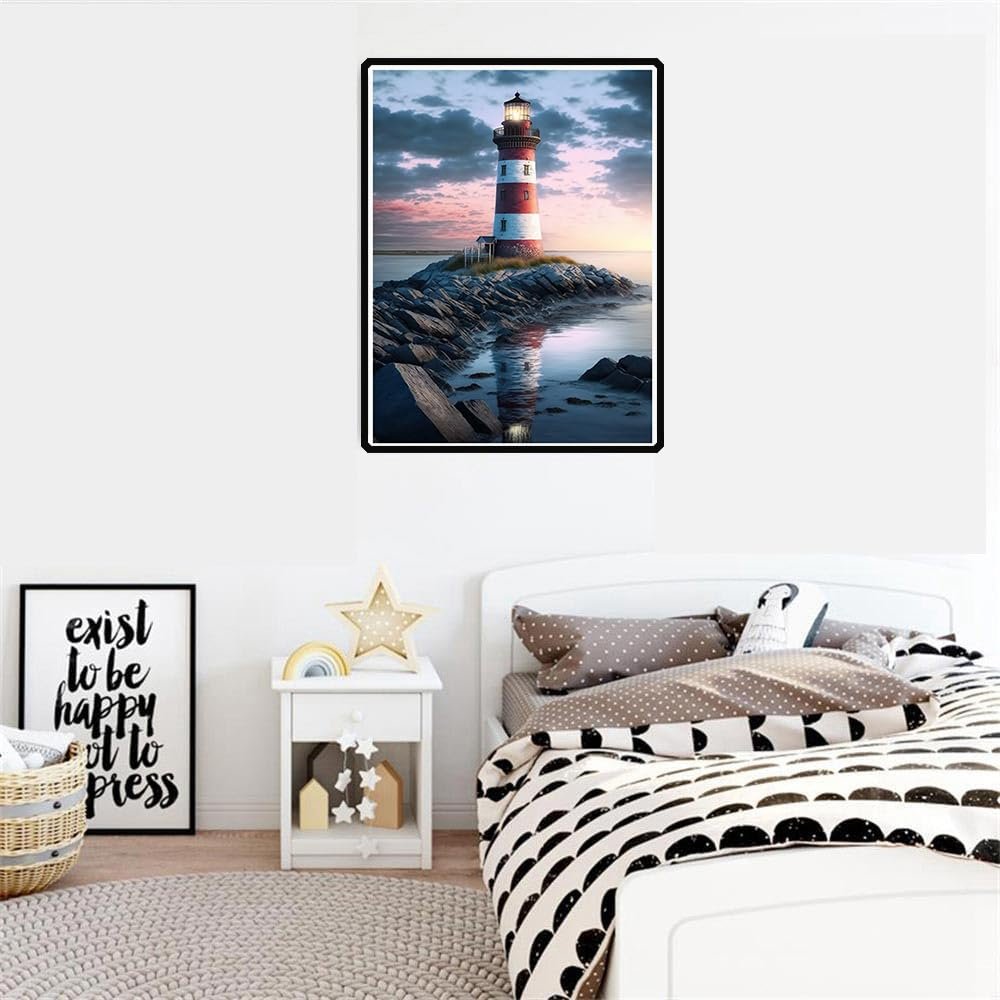 Diamond painting kit of a lighthouse on a rocky shore at sunset, displayed in a bedroom.