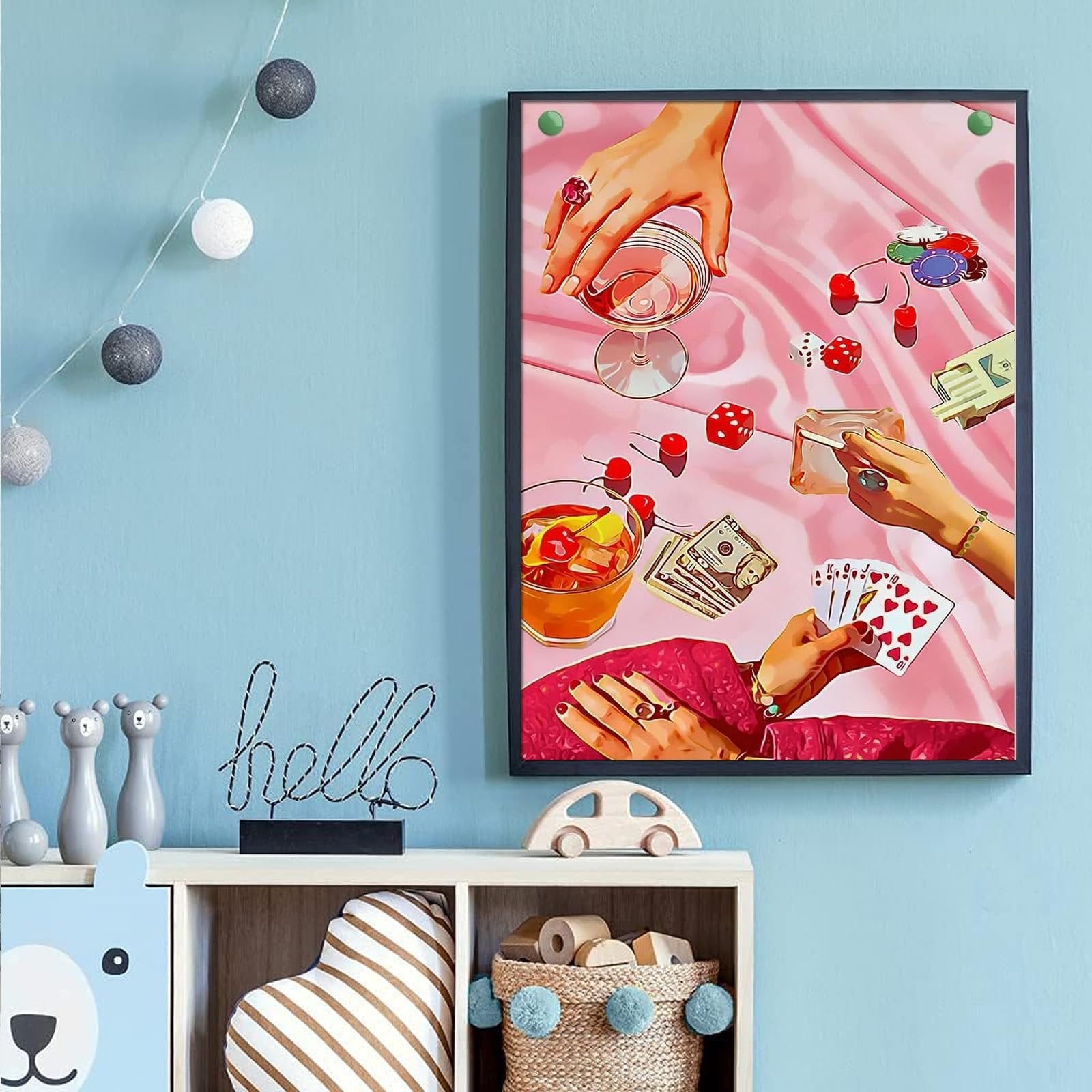Diamond painting artwork depicting hands playing cards, dice, and drinks on a pink satin cloth.
