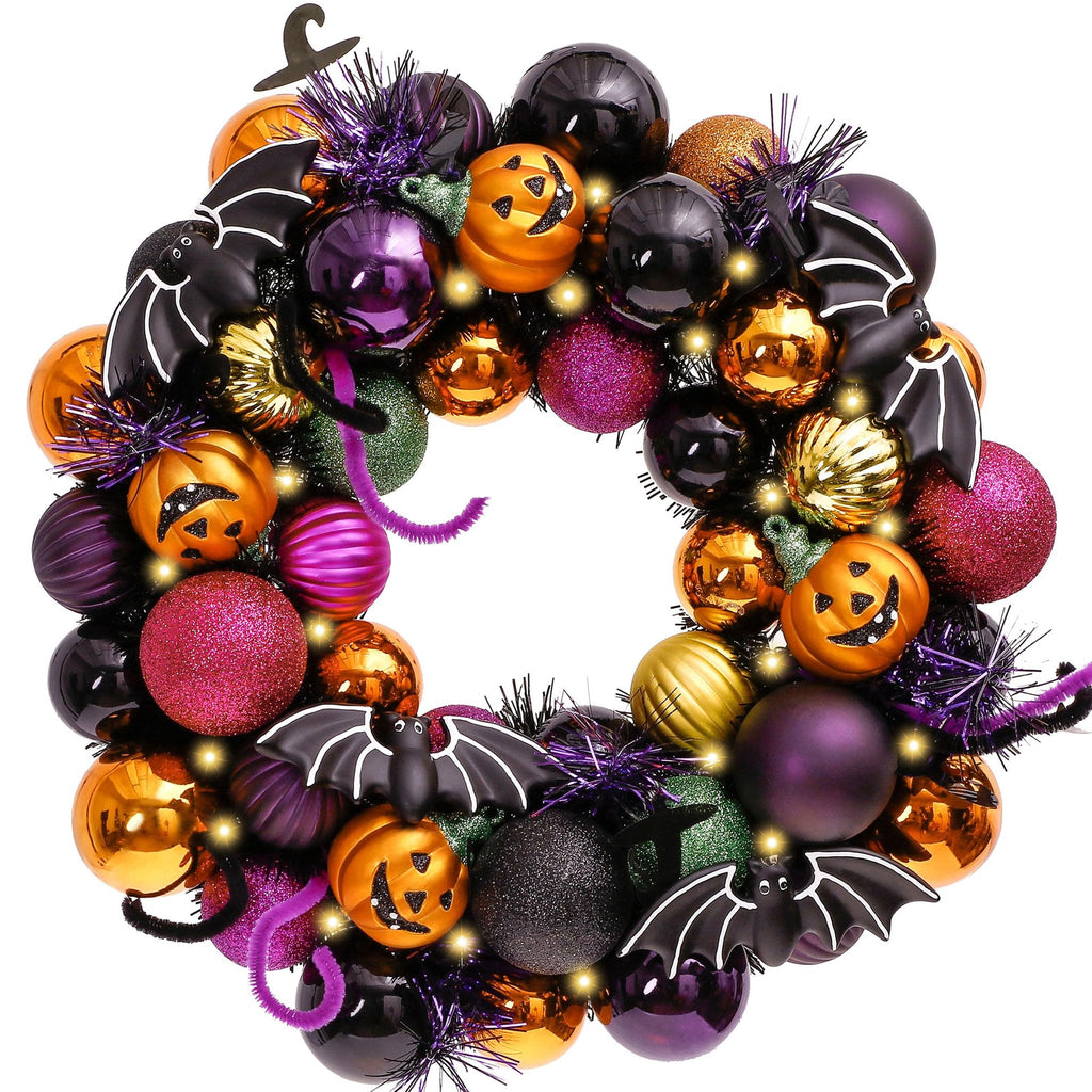 Halloween wreath with pumpkins, bats, and ornaments, featuring purple, orange, black, and gold colors with LED lights.