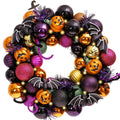 Halloween wreath with pumpkins, bats, and ornaments, featuring purple, orange, black, and gold colors with LED lights.