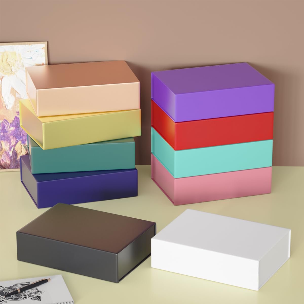 Stack of colorful collapsible gift boxes with magnetic closure lids on a table, some boxes are open.