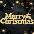 Lighted Merry Christmas sign with reindeer and tree accents, surrounded by pine branches and pinecones.