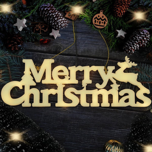 Lighted Merry Christmas sign with reindeer and tree accents, surrounded by pine branches and pinecones.