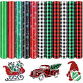 Collection of 11 rolls of Christmas-themed heat transfer vinyl with glitter, snowflakes, and buffalo plaid patterns, plus a sleigh, truck, and gnome graphic.