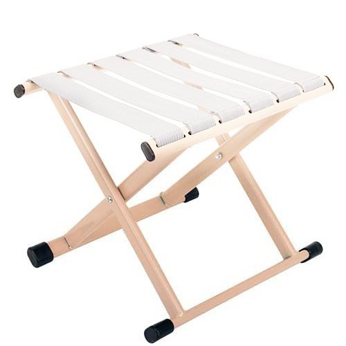 Foldable camping stool with white fabric seat and beige metal frame, shown from a low angle.