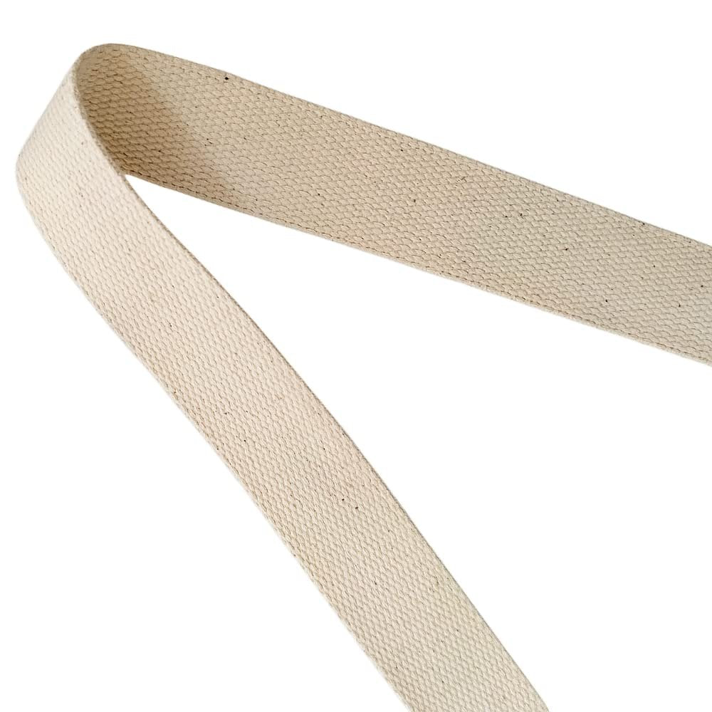 Close-up of a natural cotton webbing strap on a white background, showing texture and weave.