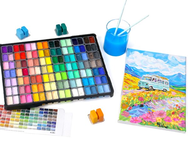 112-color gouache paint set with color chart, painting, and brushes in a cup on a white background