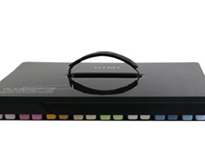 Closed black carrying case for gouache paint set, with handle and visible color tabs along the bottom edge.